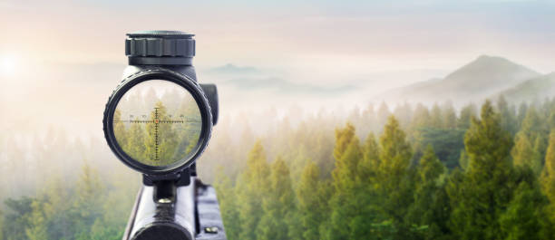 International Human Solidarity Day concept: Unity and diversity are at the heart of a diverse group of people connected together as a supportive symbol that represents a sense of teamwork. rifle target view on Natural Background. Image of a rifle scope sight used for aiming with a weapon hunting sport stock pictures, royalty-free photos & images