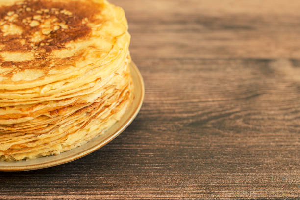 istock Delicious pancakes with chocolate sauce fresh blueberries on a rustic wooden table. Rustic brown table. 1380961347