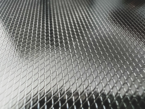 Stainless steel grating, abstract texture Metallic net background. metal mesh.