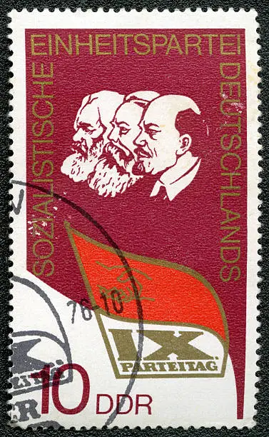 GERMANY - CIRCA 1976: A stamp printed in Germany shows Lenin, Marx, Engels and dedicated at the IX congress of the socialistic party of Germany, circa 1976