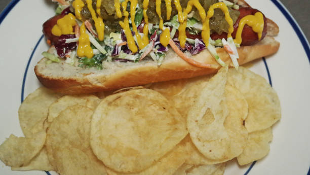 istock Hot Dog and side of Chips 1380968411