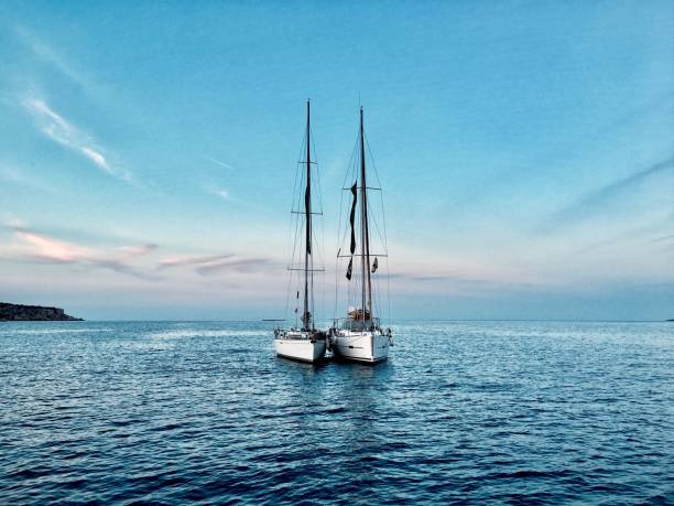 istock Two bonded sailing yachts at sea 1380970229