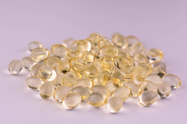 istock Many vitamin D capsules. Close-up. 1380974820