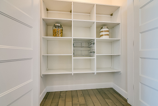 New white shelves in big pantry with room for food and small appliances