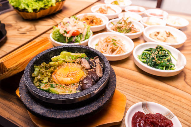 istock Korean traditional dish- bibimbap mixed rice with vegetables Include beef and fried egg and pickles set 1380980322