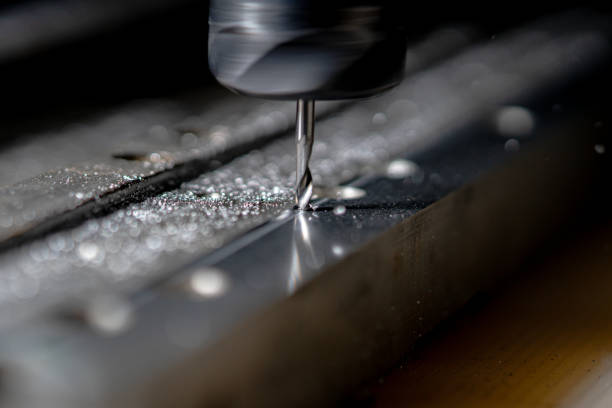 istock Metalworking CNC milling machine. Drilling steel. A drilling machine processes metal, cuts out a shape. Modern processing technology of detail. Making industrial details close up 1380980424