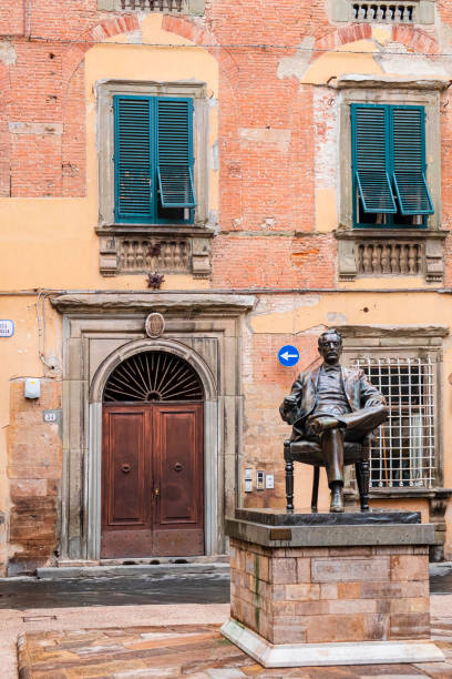 Lucca, Statue of Giacomo Puccini (Tuscany, Italy) The bronze statue of Giacomo Puccini, native to Lucca, stands out in Piazza Cittadella, in the historic center of Lucca. The statue of the famous Italian composer is an artwork of Vito Tongiani dating 1993-1994 giacomo puccini stock pictures, royalty-free photos & images