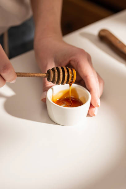 istock Small bowl of honey on a table 1380985937