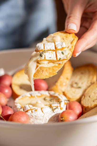 istock Eating naked brie cheese with bread 1380986023