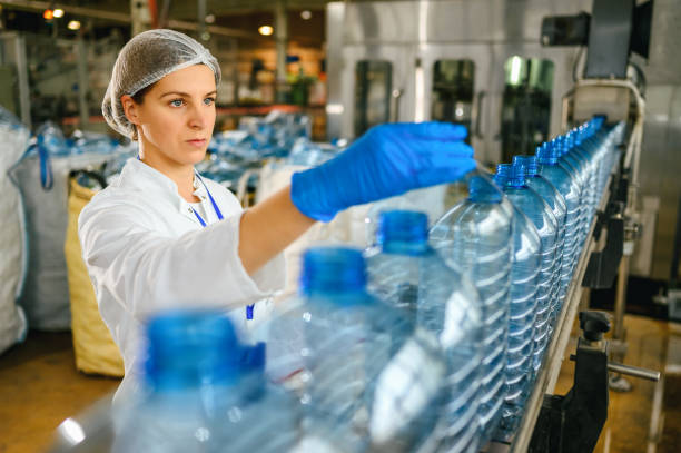 istock Female engineer working on maintenance in bottling plant 1380989031