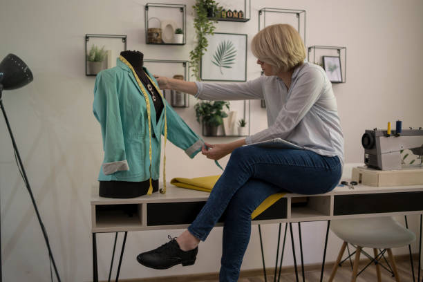 istock Young woman is sewing 1380989533