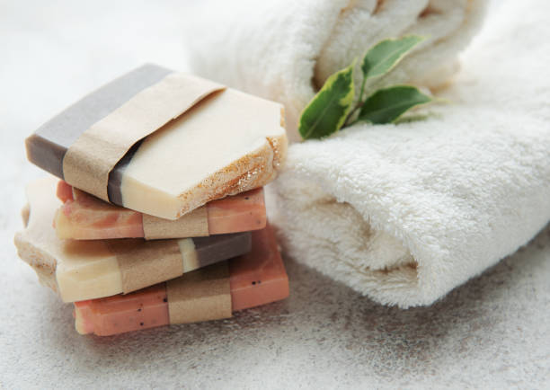 istock Handmade soap bars and green leaves 1380989565
