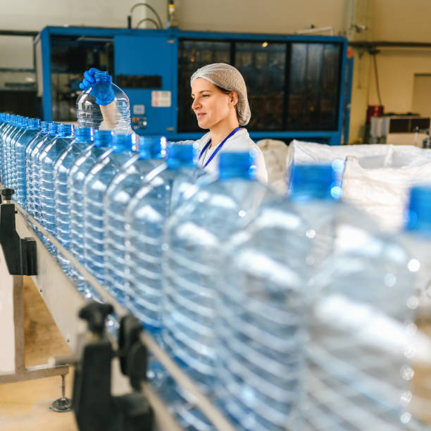 istock Female engineer working on maintenance in bottling plant 1380990593