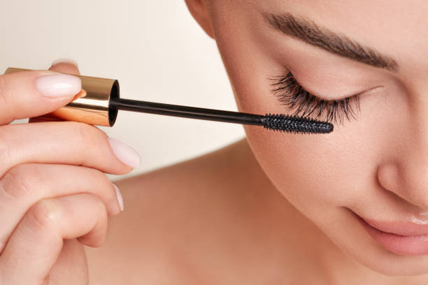 Beautiful woman with long false eyelashes