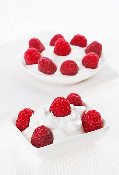 istock Still life with raspberry sour cream dessert on white linen 138099223
