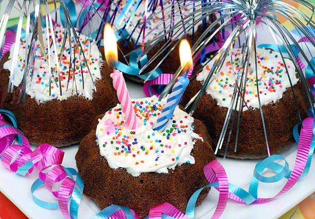 Chocolate party cupcakes with lit candles