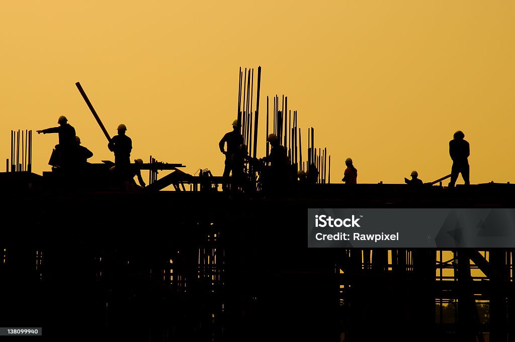 Industrial al atardecer - Foto de stock de Trabajador de construcción libre de derechos