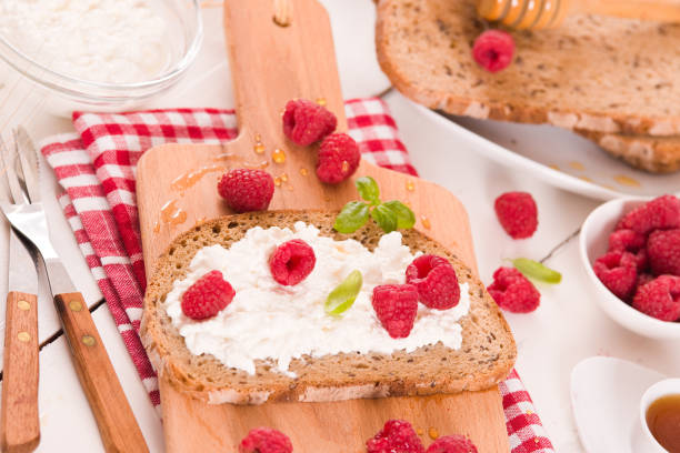 istock Rye bread with cottage cheese and raspberries. 1381015118