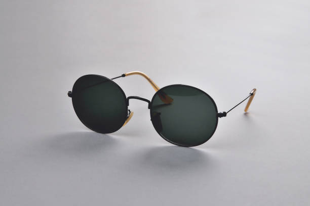 istock Glasses from the sun, stylish sunglasses on a gray background, selective focus 1381019380