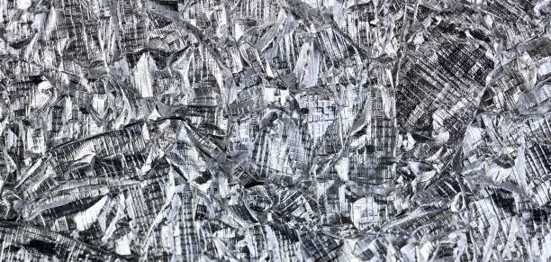 istock Foil silver crumpled metal aluminum texture background surface decoration backdrop design photo. 1381019407