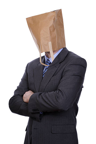 Businessman with a brown paper bag over his head Anonymous businessman embarrassment unrecognizable person wearing a paper bag human head stock pictures, royalty-free photos & images