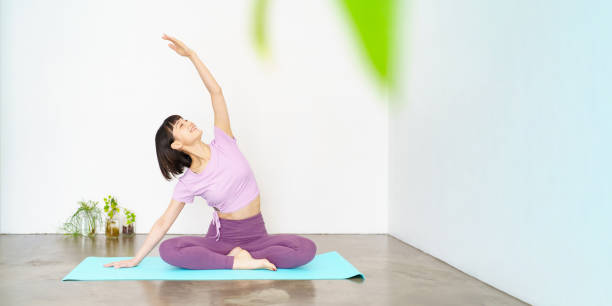 istock Woman doing yoga and flexible exercise 1381023205