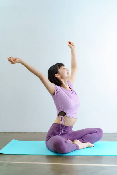 istock A woman taking a deep breath between yoga 1381038597