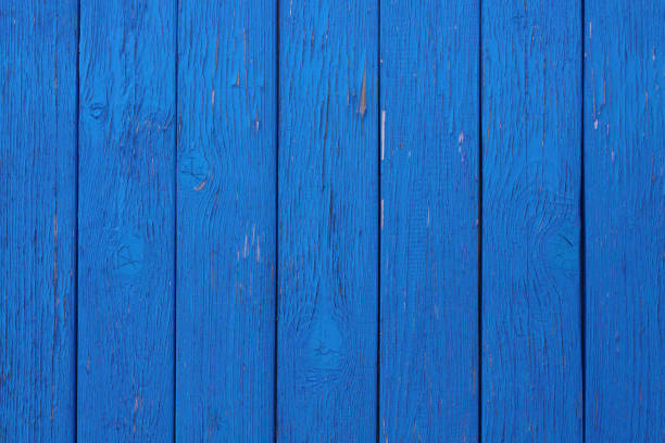 Old wooden boards painted blue. Close-up. Vertical view. Background. Texture.