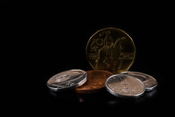 czech crown  coins of various denominations on a black background - czech culture currency wealth coin imagens e fotografias de stock