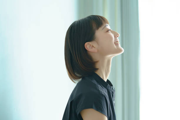 Profile of a woman Profile of a woman with black hair asian woman stock pictures, royalty-free photos & images