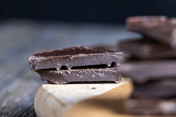 istock pieces of milk chocolate are lying on the table 1381062446