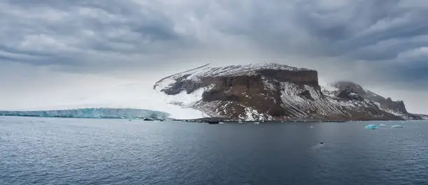 Photo of View of the brown bluff, a stunning basalt tuya on the Tabarin Peninsula of northern Antarctica. Formed 1 million years ago by a subglacial volcanic eruptions