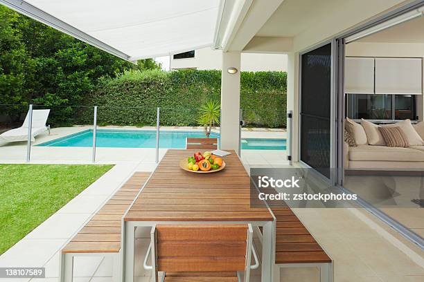 Modern Backyard And Living Room Stock Photo - Download Image Now - Swimming Pool, Paved Yard, Home Interior
