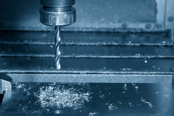 istock The CNC milling machine drilling process on the metal plate. 1381077900