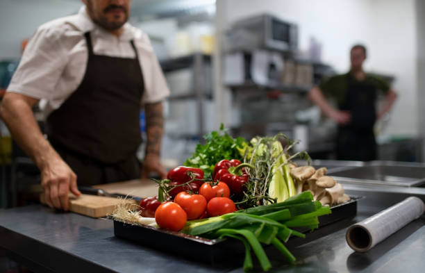 istock Fresh ripe vegetables prepared for cutting in commercial kitchen. 1381121126