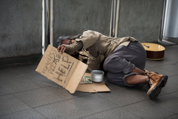 istock Old Homeless man raise help plate to ask money 1381126473