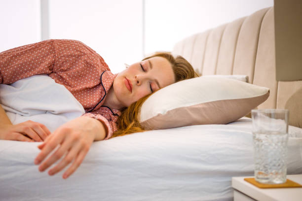istock Pretty woman sleeping in bed. Bright colors. 1381138763