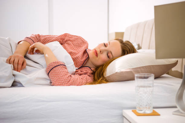 istock Pretty woman sleeping in bed. 1381138841