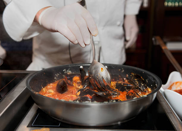 istock Mussels being fried in pan with tomato sauce 138114881