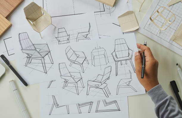 istock Designer sketching drawing design development product plan draft chair armchair Wingback Interior furniture prototype manufacturing production. designer studio concept . 1381150480