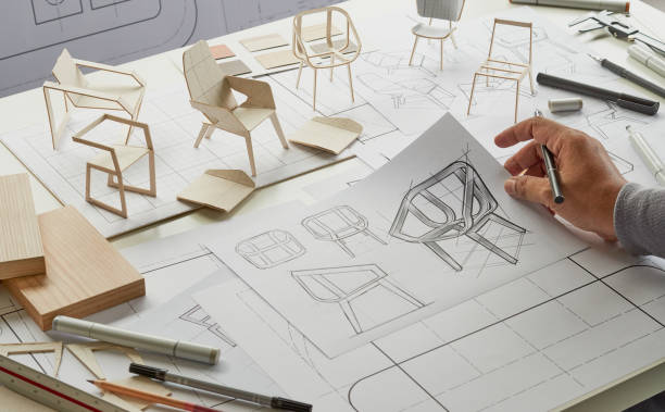 istock Designer sketching drawing design development product plan draft chair armchair Wingback Interior furniture prototype manufacturing production. designer studio concept . 1381150481