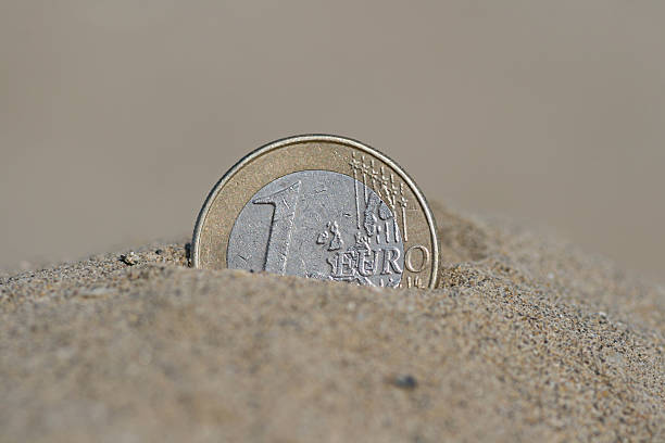 istock Euro on the sand 138115712