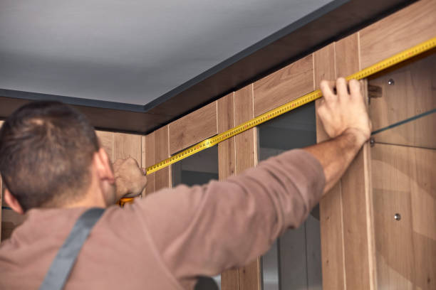 istock Handyman making kitchen wall cabinets in the apartment. 1381161491