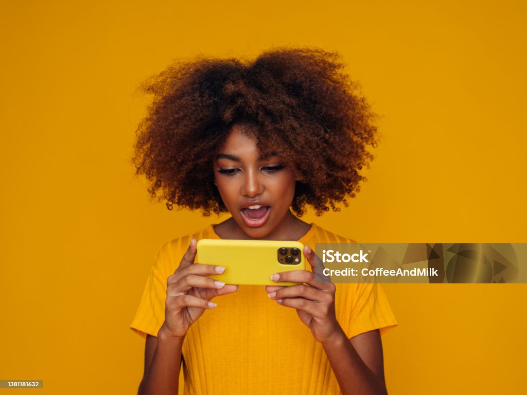 Woman holding a smart phone Leisure Games Stock Photo