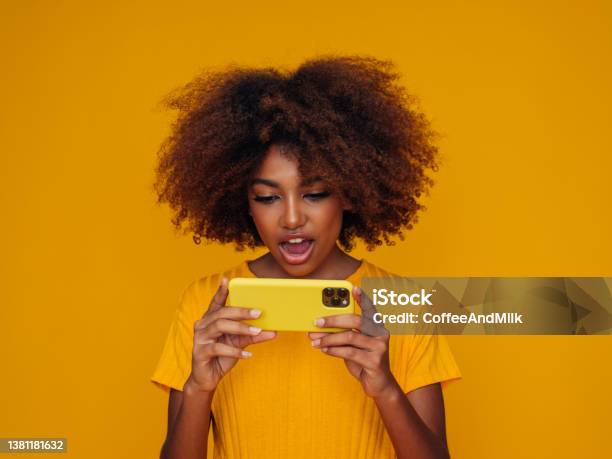 Woman Holding A Smart Phone Stock Photo - Download Image Now - Leisure Games, Cut Out, Brand Name Smart Phone