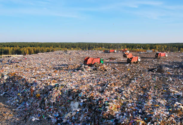 istock Landfill waste disposal. Garbage dump with waste plastic and polyethylene. Garbage truck unloads rubbish in landfill. Reduce greenhouse gas emissions and methane emissions. Environmental protection. 1381186412