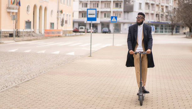 istock A man riding along the street on his scooter 1381190688