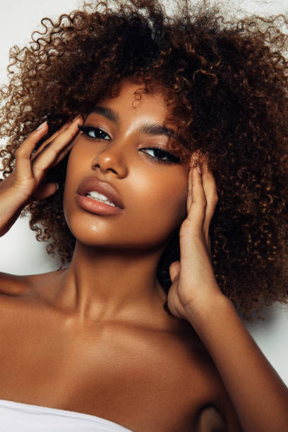 istock Beautiful afro girl with curly hairstyle 1381199426
