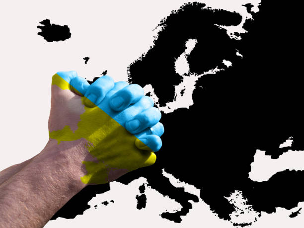 istock Praying hands in Ukraine colors with Europe map 1381220130