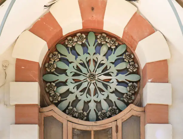 Photo of Art nouveau style window with forged metal details